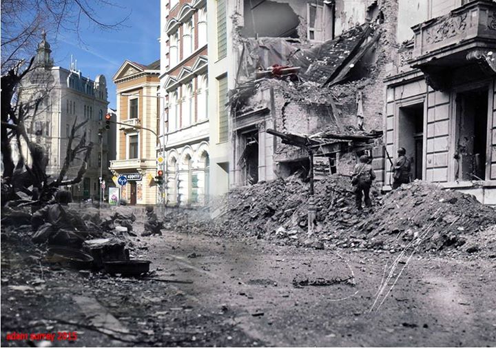 Amerykanie na ulicach Akwizgranu, który w roku 1944 był pierwszym niemieckim miastem zajętym przez wojska alianckie. Krwawe walki o miasto spowodowały zniszczenie 65% zabudowy. Po wojnie częściowo odbudowane.