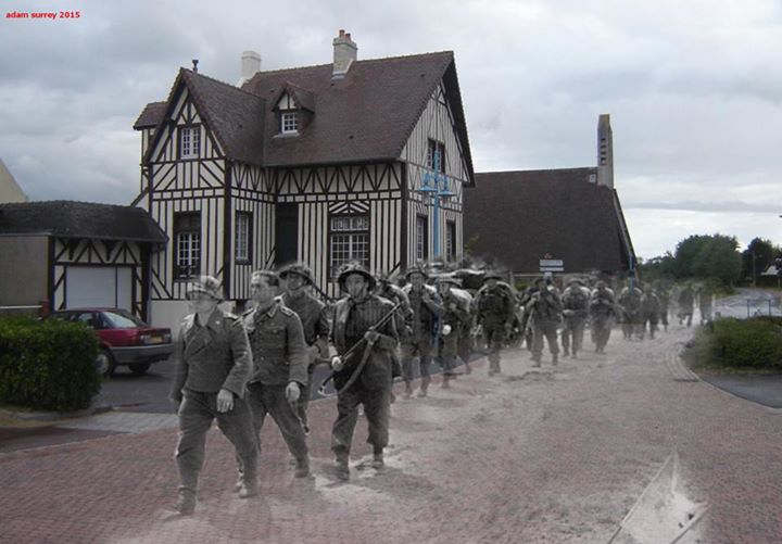 Niemieccy jeńcy wojenni maszerują przez francuską miejscowość Hermanville