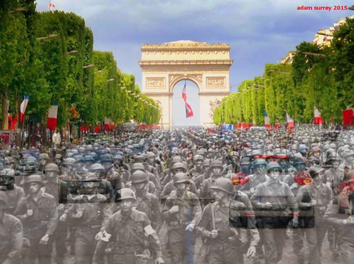 Amerykańscy żołnierze z 28. Dywizji Piechoty maszerują przez Pola Elizejskie w Paryżu. W tle widoczny Łuk Triumfalny